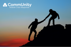 The silhouette of one cliber assists another climber onto higher ground. The background is lit and colored by a sunset. The top left corner of the image features the brand's name: CommUnity Mobile Crisis Response